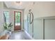 Charming foyer with a decorative mirror, plant, and a stylish front door with sidelights at 5135 Park Creek Ave, North Charleston, SC 29418