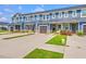 Attractive townhome exteriors with well-kept lawns, stone accents and inviting front entrances at 5135 Park Creek Ave, North Charleston, SC 29418