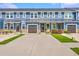 Charming townhomes with stone accents, manicured lawns and inviting front entrances and garages at 5135 Park Creek Ave, North Charleston, SC 29418