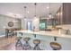 Open-concept kitchen with modern stainless steel appliances, a breakfast bar, and ample seating for entertaining at 5135 Park Creek Ave, North Charleston, SC 29418
