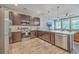 Modern kitchen featuring stainless steel appliances, quartz countertops, dark cabinetry, and open concept layout at 5135 Park Creek Ave, North Charleston, SC 29418