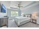 This tranquil main bedroom features soft blue walls, plush carpeting, and large windows that fill the room with natural light at 5135 Park Creek Ave, North Charleston, SC 29418