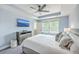 Comfortable main bedroom with tray ceilings, television, and bright windows for optimal natural light at 5135 Park Creek Ave, North Charleston, SC 29418