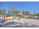 Fun community playground adjacent to pond featuring water fountain at 5135 Park Creek Ave, North Charleston, SC 29418