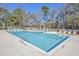 Inviting community pool with lounge chairs, picnic tables and clear, refreshing water at 5135 Park Creek Ave, North Charleston, SC 29418