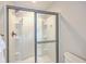Modern shower with a glass sliding door, built-in shelving, and a rainfall shower head at 5135 Park Creek Ave, North Charleston, SC 29418