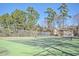 Well-maintained community tennis court surrounded by lush greenery at 5135 Park Creek Ave, North Charleston, SC 29418
