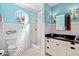 Bright bathroom featuring stylish fixtures, black and white mosaic tile floor, and a shower at 6002 Green Dolphin Way, Kiawah Island, SC 29455