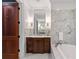 Spa-like bathroom offers a soaking tub, beautiful finishes, and ample natural light at 6002 Green Dolphin Way, Kiawah Island, SC 29455