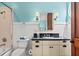 Charming bathroom with a vanity, black countertop, toilet and a shower-tub with tile surround at 6002 Green Dolphin Way, Kiawah Island, SC 29455
