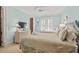 This comfortable bedroom has two twin beds, a ceiling fan, shuttered windows and a closet at 6002 Green Dolphin Way, Kiawah Island, SC 29455