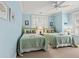 Charming blue bedroom featuring two twin beds with coastal accents, perfect for guests or Gathering at 6002 Green Dolphin Way, Kiawah Island, SC 29455