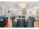 Bright dining room with a chandelier and a view of the modern white kitchen at 6002 Green Dolphin Way, Kiawah Island, SC 29455