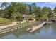 Picturesque dock with a charming building amidst lush greenery and waterway access at 6002 Green Dolphin Way, Kiawah Island, SC 29455