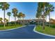 Beautiful home exterior featuring a circular driveway lined with palm trees at 6002 Green Dolphin Way, Kiawah Island, SC 29455