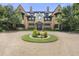 Luxury estate home with circular driveway and lavish landscaping at 6002 Green Dolphin Way, Kiawah Island, SC 29455