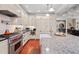 Modern kitchen with granite countertops, stainless steel appliances, and a farmhouse sink at 6002 Green Dolphin Way, Kiawah Island, SC 29455