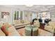 Well-lit living room with stylish furniture and an open view to the kitchen at 6002 Green Dolphin Way, Kiawah Island, SC 29455