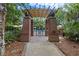 Arbored entrance to the neighborhood pool surrounded by lush vegetation at 6002 Green Dolphin Way, Kiawah Island, SC 29455