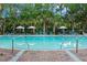 Resort-style community pool surrounded by lounge chairs and palm trees at 6002 Green Dolphin Way, Kiawah Island, SC 29455