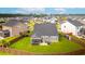 Expansive aerial view of a home showcasing its well-maintained lawn and patio area at 627 Macintyre Cir, Summerville, SC 29486