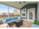Cozy screened-in back porch with comfortable seating and a stylish outdoor table at 627 Macintyre Cir, Summerville, SC 29486