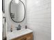 Bright bathroom features wood vanity with marble countertops and shiplap walls at 627 Macintyre Cir, Summerville, SC 29486