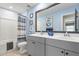 Bright bathroom with double sink vanity, framed mirror, and tub shower combo at 627 Macintyre Cir, Summerville, SC 29486