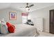 Bright bedroom with a comfortable bed, ceiling fan, and a study desk at 627 Macintyre Cir, Summerville, SC 29486