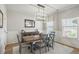 Bright dining room with modern chandelier, stylish buffet, and large windows for natural light at 627 Macintyre Cir, Summerville, SC 29486