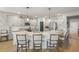 Open kitchen with gray cabinets, stainless steel appliances, and a large island with breakfast bar seating at 627 Macintyre Cir, Summerville, SC 29486