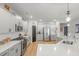 Bright kitchen with gray cabinets, stainless appliances, subway tile backsplash, and a large island at 627 Macintyre Cir, Summerville, SC 29486