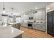 Spacious kitchen featuring gray cabinets, stainless steel appliances, and a large island with a white countertop at 627 Macintyre Cir, Summerville, SC 29486