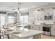 Well-lit kitchen with gray cabinets, stainless appliances, and a large island with seating for the Gathering at 627 Macintyre Cir, Summerville, SC 29486