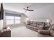 Cozy living room featuring plush seating, ceiling fan, and natural light at 627 Macintyre Cir, Summerville, SC 29486