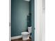 Powder bathroom with wood floors, toilet, and floating wood shelves for storage at 661 Black Pine Rd, Moncks Corner, SC 29461