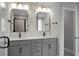 Modern bathroom with double vanity, patterned accent wall, and black hardware at 661 Black Pine Rd, Moncks Corner, SC 29461