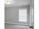 Bedroom features gray carpet, neutral walls, single window, and standard door at 661 Black Pine Rd, Moncks Corner, SC 29461