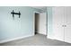 This bedroom features a closet, modern gray carpet, and a TV mount ready for entertainment setup at 661 Black Pine Rd, Moncks Corner, SC 29461