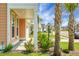 Home's column-lined porch with lovely landscaping and palm trees on the front lawn at 661 Black Pine Rd, Moncks Corner, SC 29461