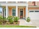 Inviting home exterior with a charming porch and manicured landscaping leading to the front door at 661 Black Pine Rd, Moncks Corner, SC 29461