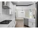 Modern kitchen with stainless appliances, gas range, white cabinets, and a breakfast bar at 661 Black Pine Rd, Moncks Corner, SC 29461