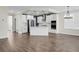 Modern kitchen features stainless appliances, white cabinetry, island, and wood-look floors at 661 Black Pine Rd, Moncks Corner, SC 29461