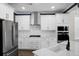 Modern kitchen featuring stainless steel appliances, white cabinets, and a stylish sink at 661 Black Pine Rd, Moncks Corner, SC 29461