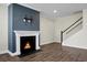 Beautiful living room featuring fireplace with mantel and adjacent staircase at 661 Black Pine Rd, Moncks Corner, SC 29461