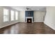 Spacious living room features hardwood floors, natural light, and a fireplace at 661 Black Pine Rd, Moncks Corner, SC 29461