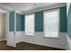 Bright office space features two white windows, wood floors, and blue painted walls with wainscoting at 661 Black Pine Rd, Moncks Corner, SC 29461