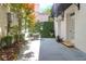 Private backyard patio with lush greenery, charming ivy wall, and outdoor dining set at 8 & 8 1/2 Elliott St # 8 & 8 1/2, Charleston, SC 29401