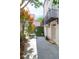 Private backyard patio with lush greenery, charming ivy wall, and outdoor dining set at 8 & 8 1/2 Elliott St # 8 & 8 1/2, Charleston, SC 29401