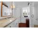 Stylish bathroom with a vessel sink, glass shower, and hardwood floors, combining modern design with classic charm at 8 & 8 1/2 Elliott St # 8 & 8 1/2, Charleston, SC 29401